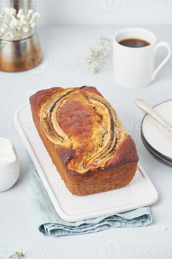 Whole Banana bread. Cake with banana and walnut, american cuisine. Side view, vertical photo