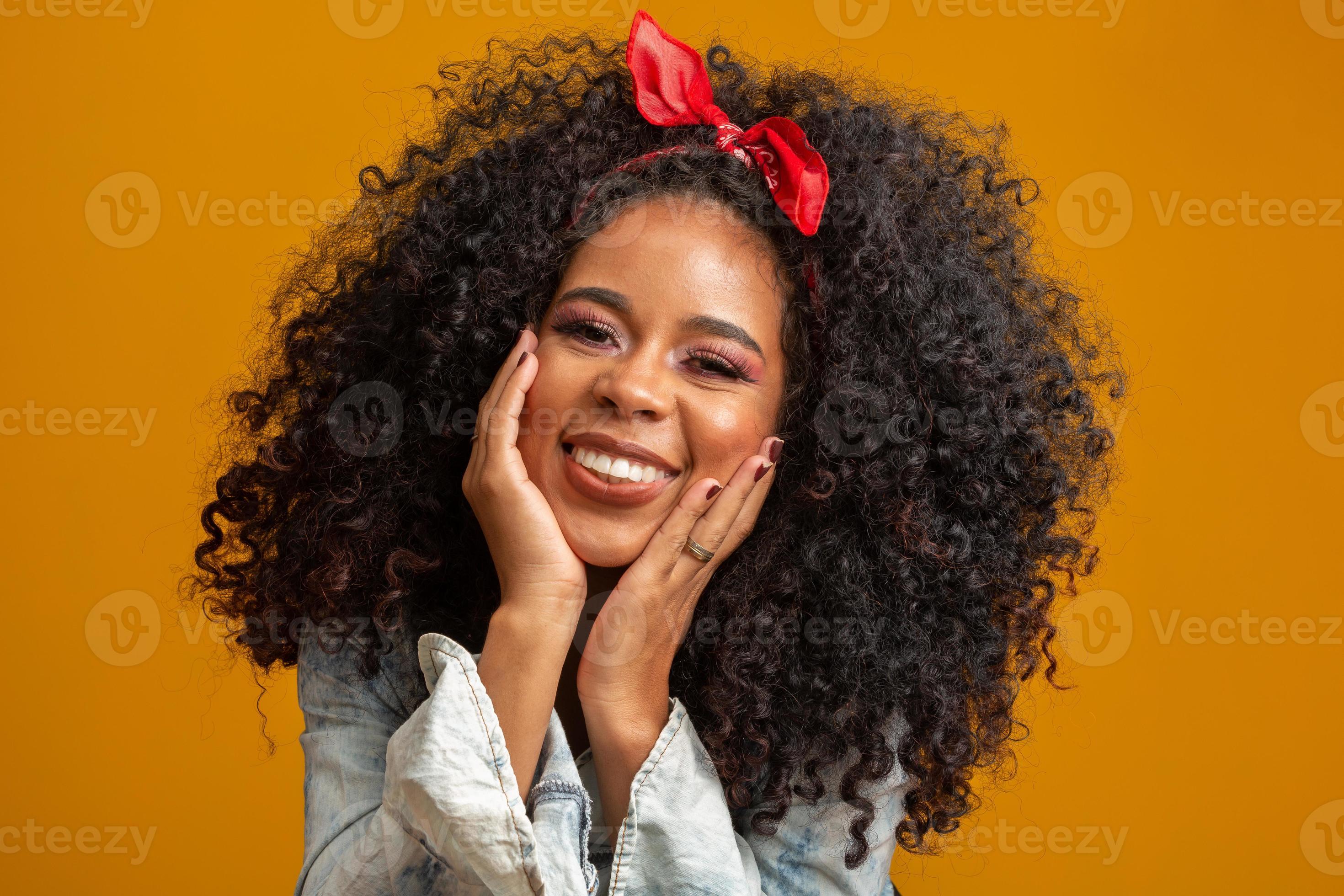 Beauty portrait of african american woman with afro hairstyle and glamour  makeup. Brazilian woman. Mixed race. Curly hair. Hair style. Yellow  background. 7547821 Stock Photo at Vecteezy