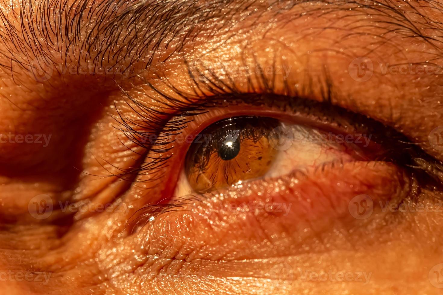 Close-up of the human eye. The look is thoughtful. Sunrise, Sunset. Horizon. The concept of a difficult and important choice. photo