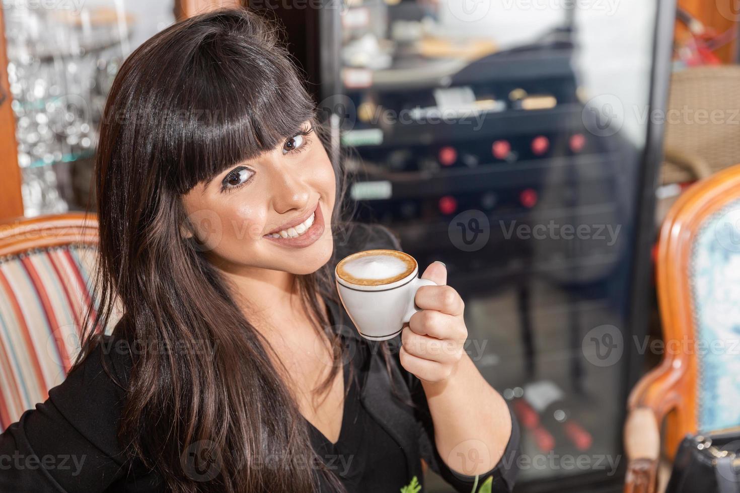 Woman drinking coffee table. Women in cafe. photo