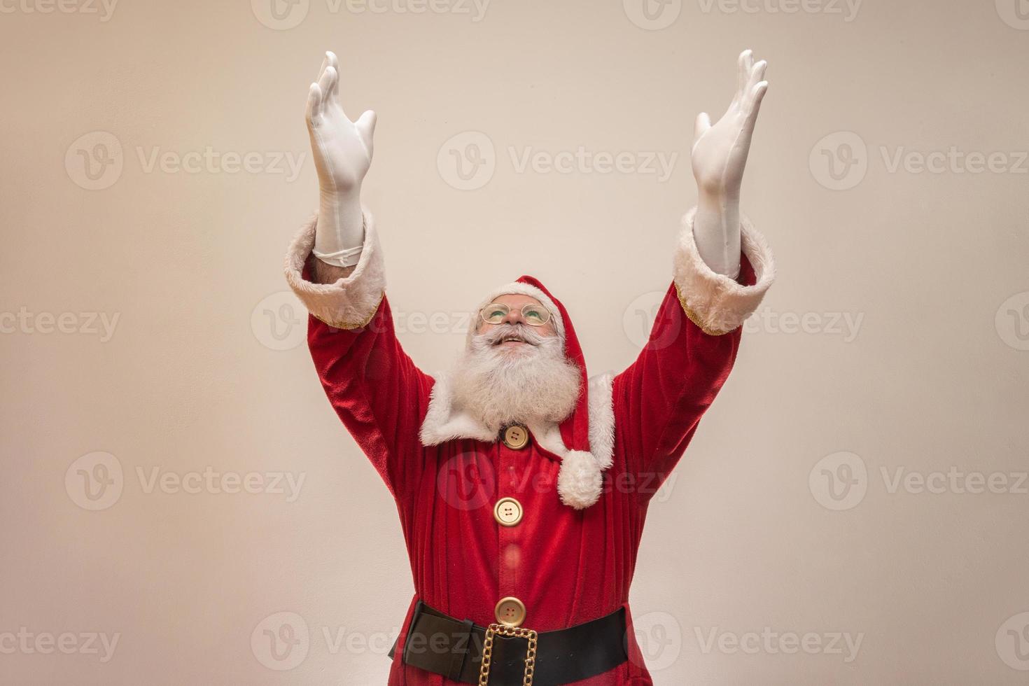 Santa Claus on white background with copy space. Presenting. photo