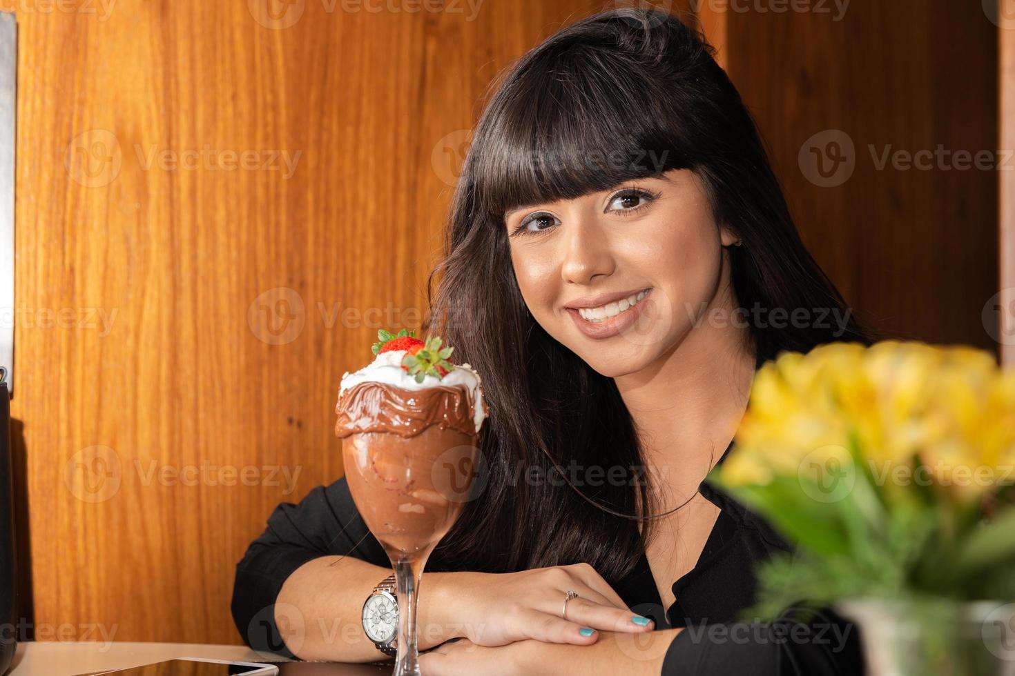 Ice cream white blends strawberry with high calories, can make you fat, soft focus, blurred. Delicious vanilla or chocolate sundae with strawberry. photo