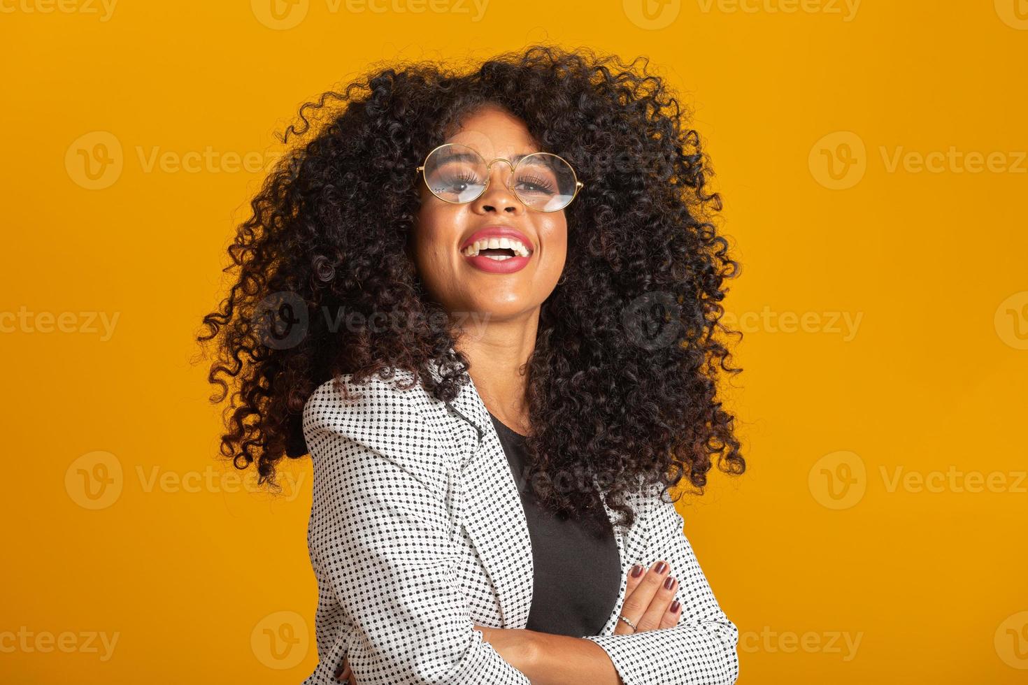 Business black woman on a yellow background photo