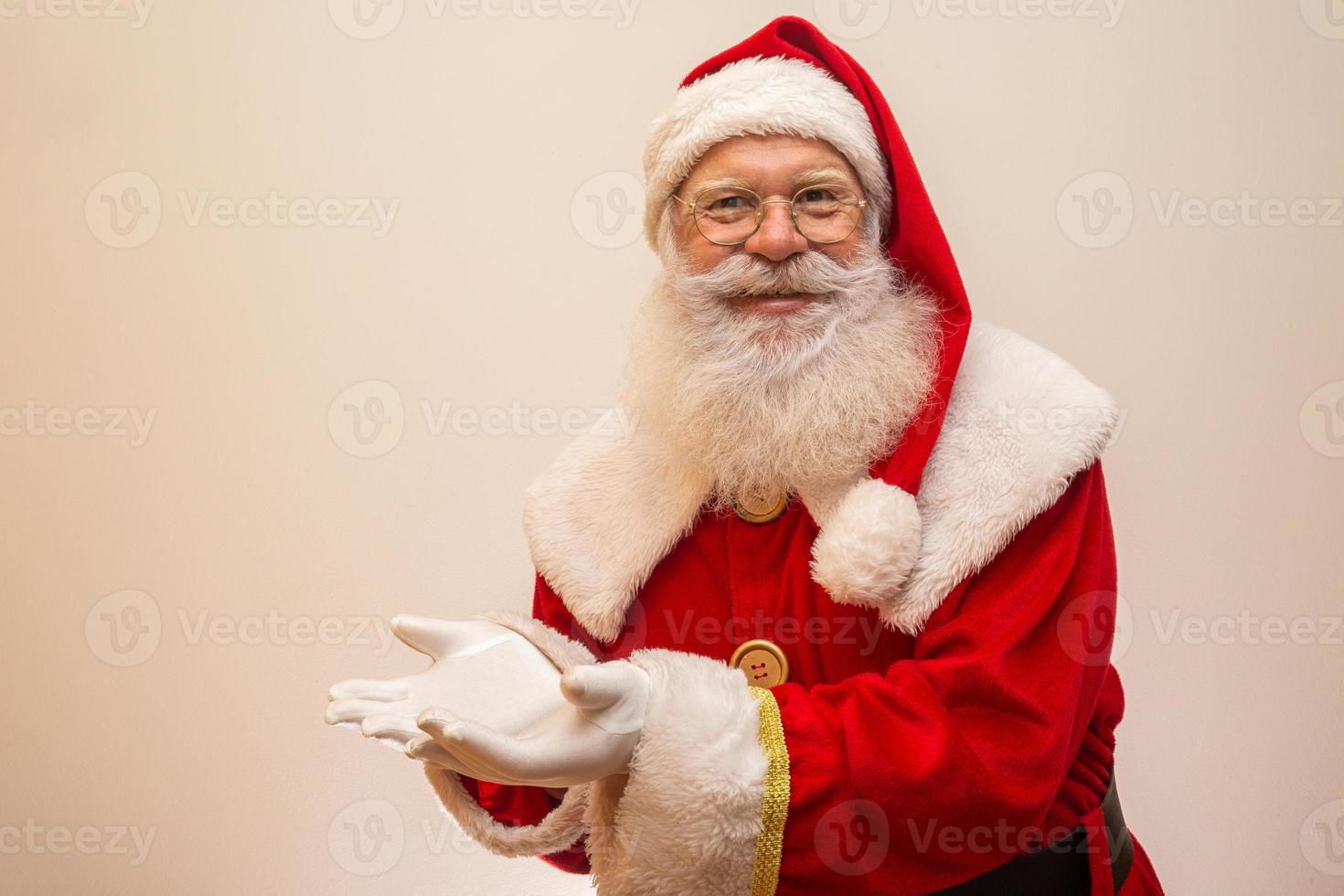 Santa Claus on white background with copy space. Presenting. photo