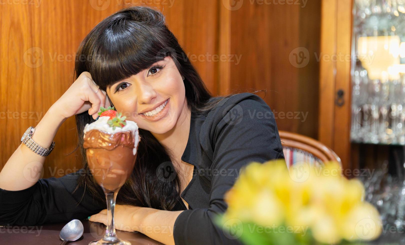 Ice cream white blends strawberry with high calories, can make you fat, soft focus, blurred. Delicious vanilla or chocolate sundae with strawberry. photo