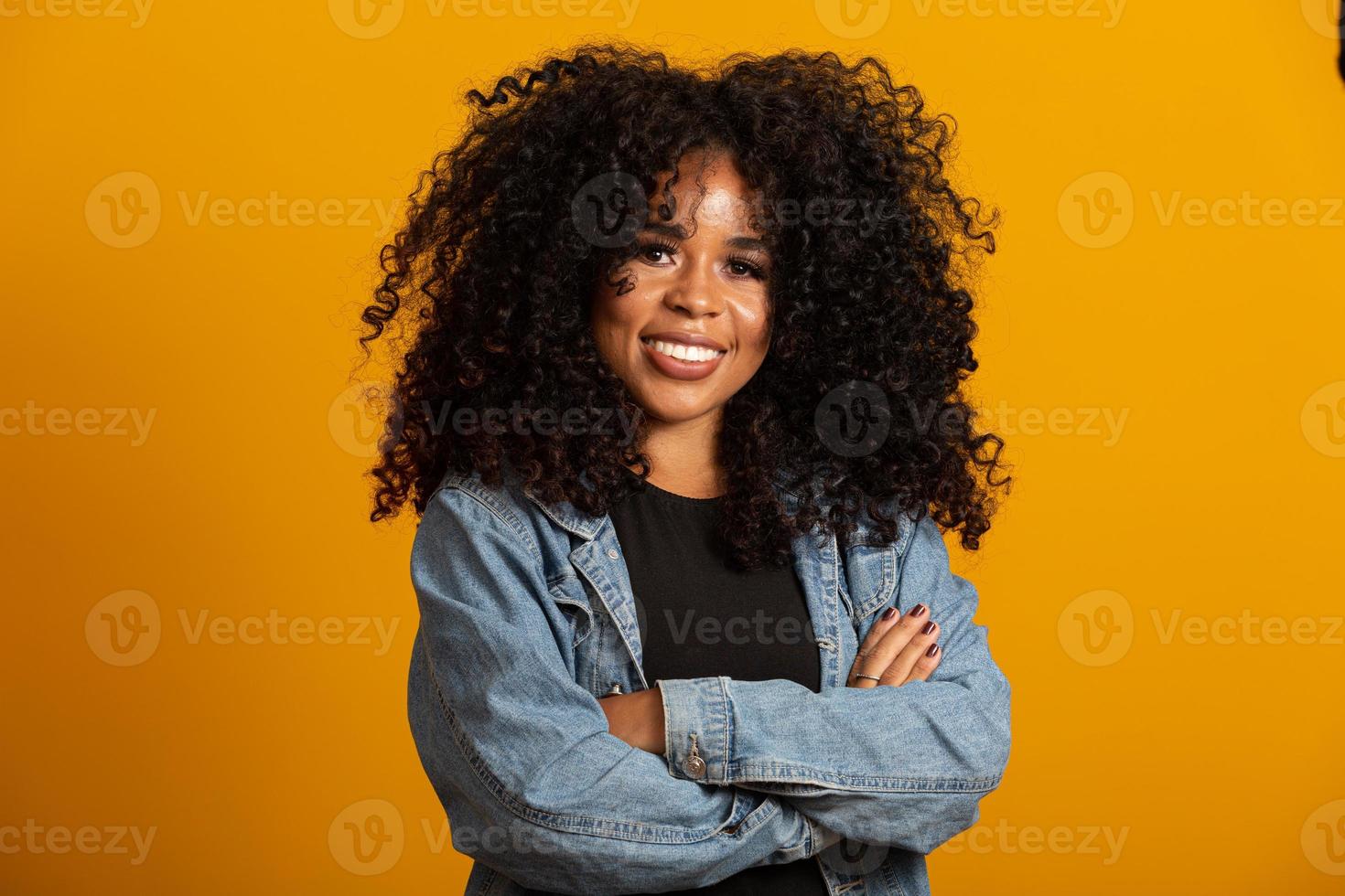Business black woman on a yellow background photo