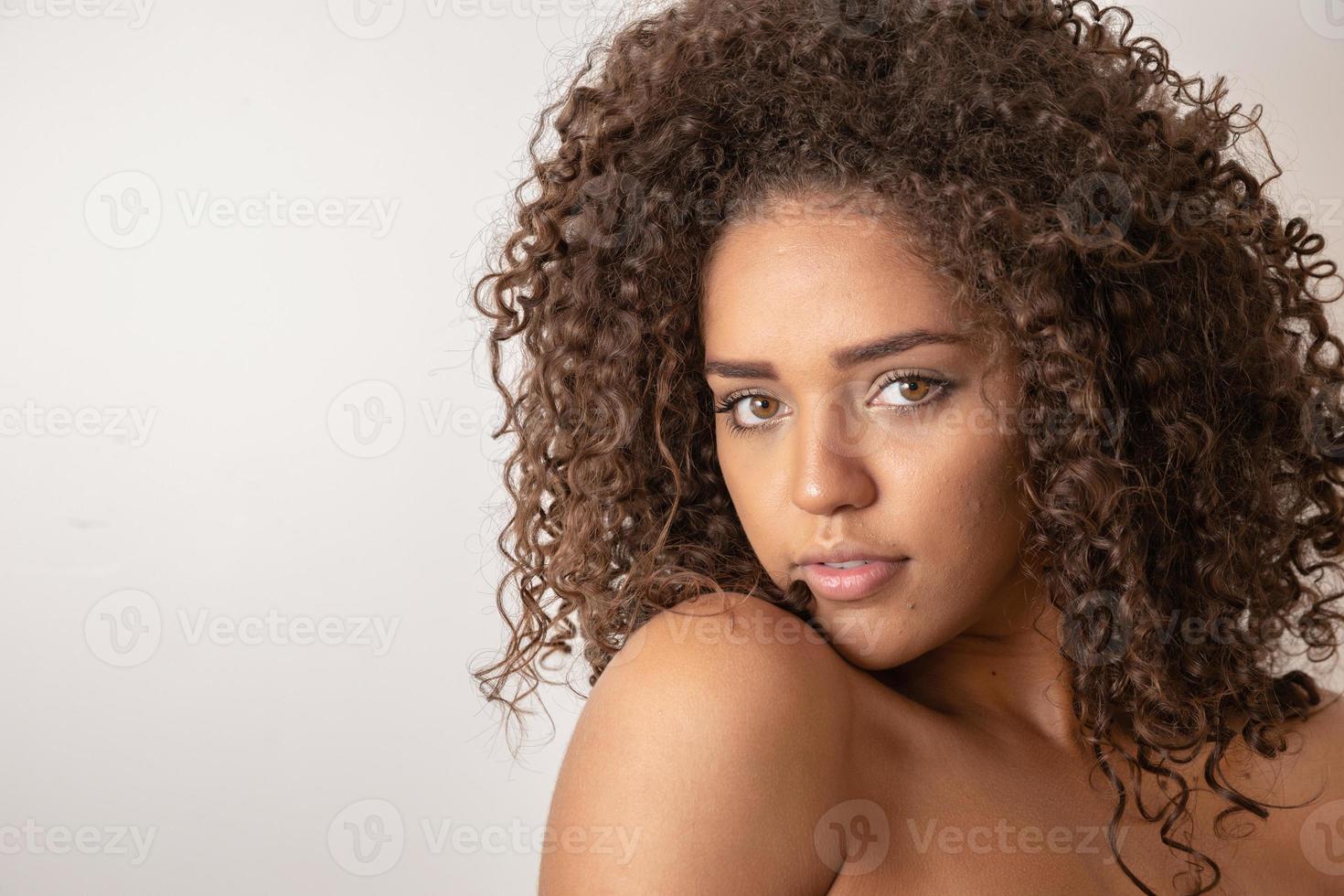 Beauty portrait of african american woman with afro hairstyle and glamour makeup photo