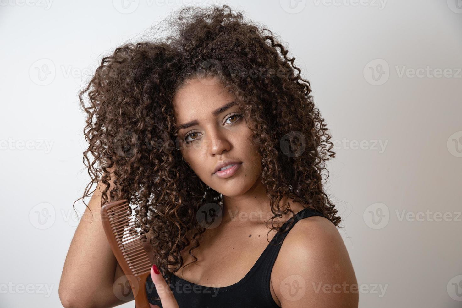 Beauty portrait of african american woman with afro hairstyle and glamour makeup photo