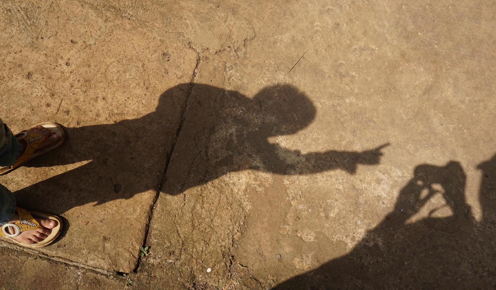 the shadow of a child on a sunny morning photo