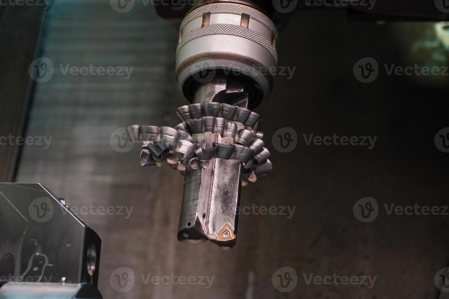 Solid Carbide Indexable Insert Drill Bit that is full of metal chips from the drill.horizontal drilling machine photo