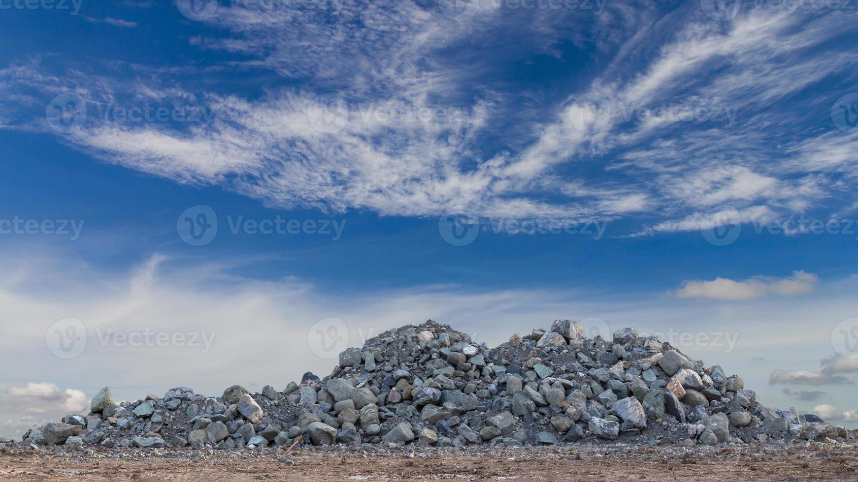 Large granite piles with sky clouds. photo