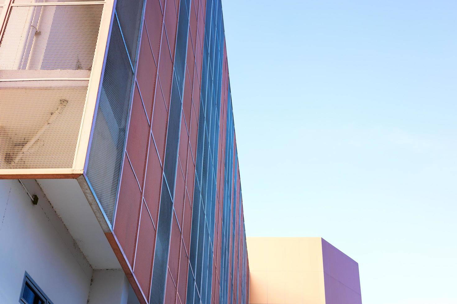 Low angle view, close-up view of a beautiful orange new building. photo