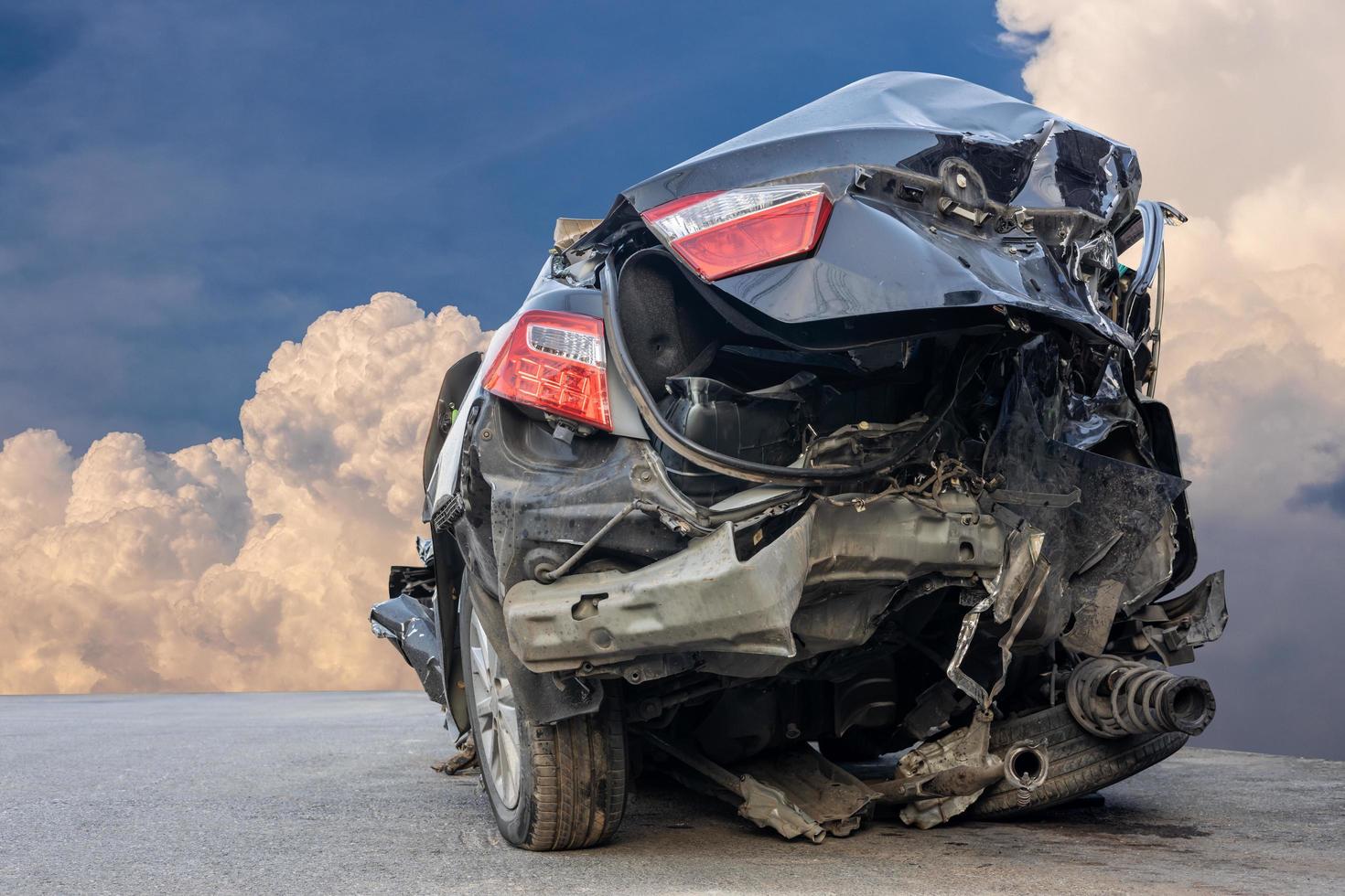 The wreckage of the rear of a black sedan smashed into wreckage until it turned into scrap metal. photo