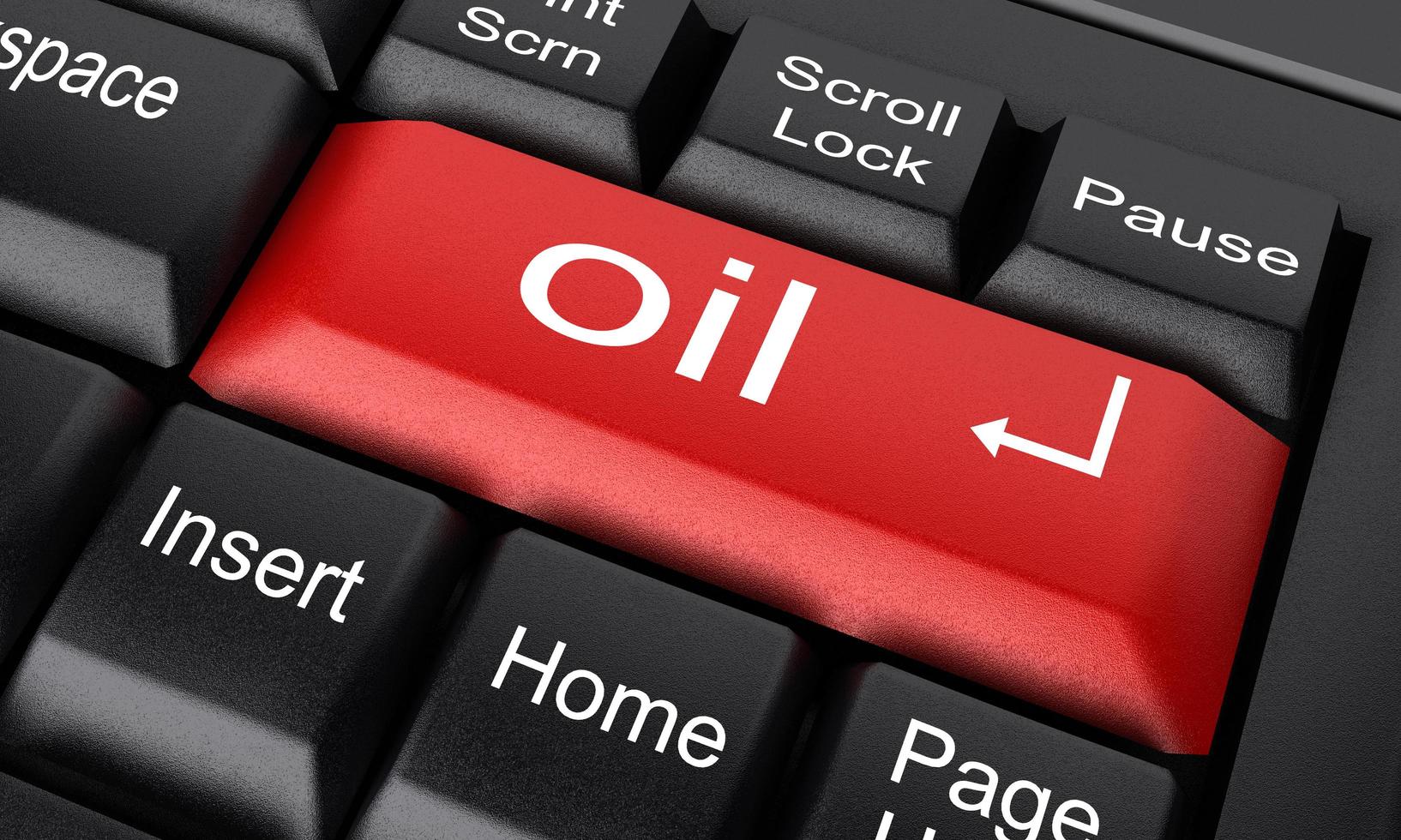 oil word on red keyboard button photo