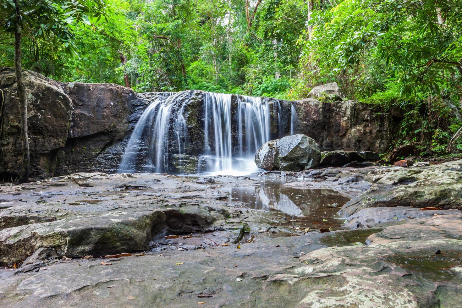 Tropical waterfall in rain forest photo