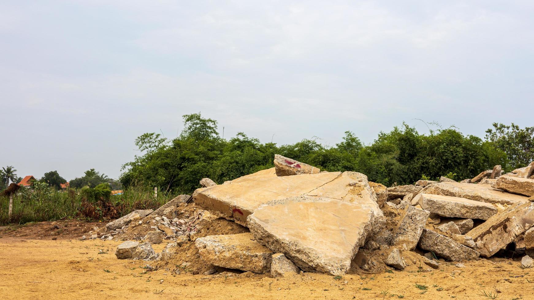 A view of the rubble of many large concrete blocks that have been demolished. photo
