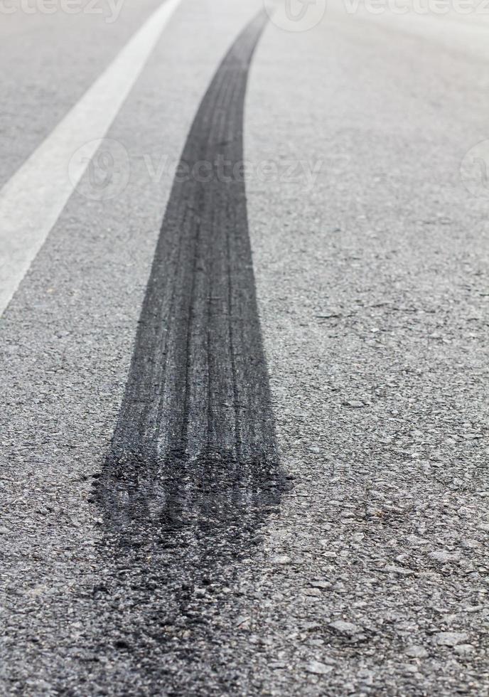 Wheel brake marks on the road. photo