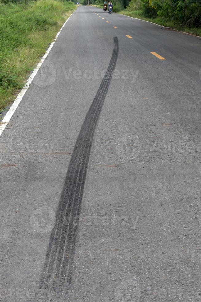 Traces of black tire brakes on the road. photo