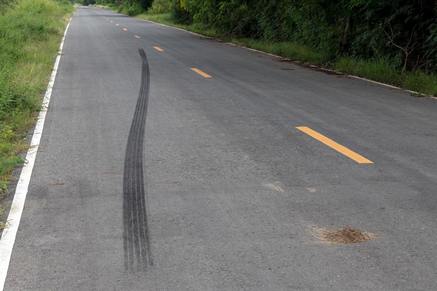 Traces of black tire brakes on the road. photo