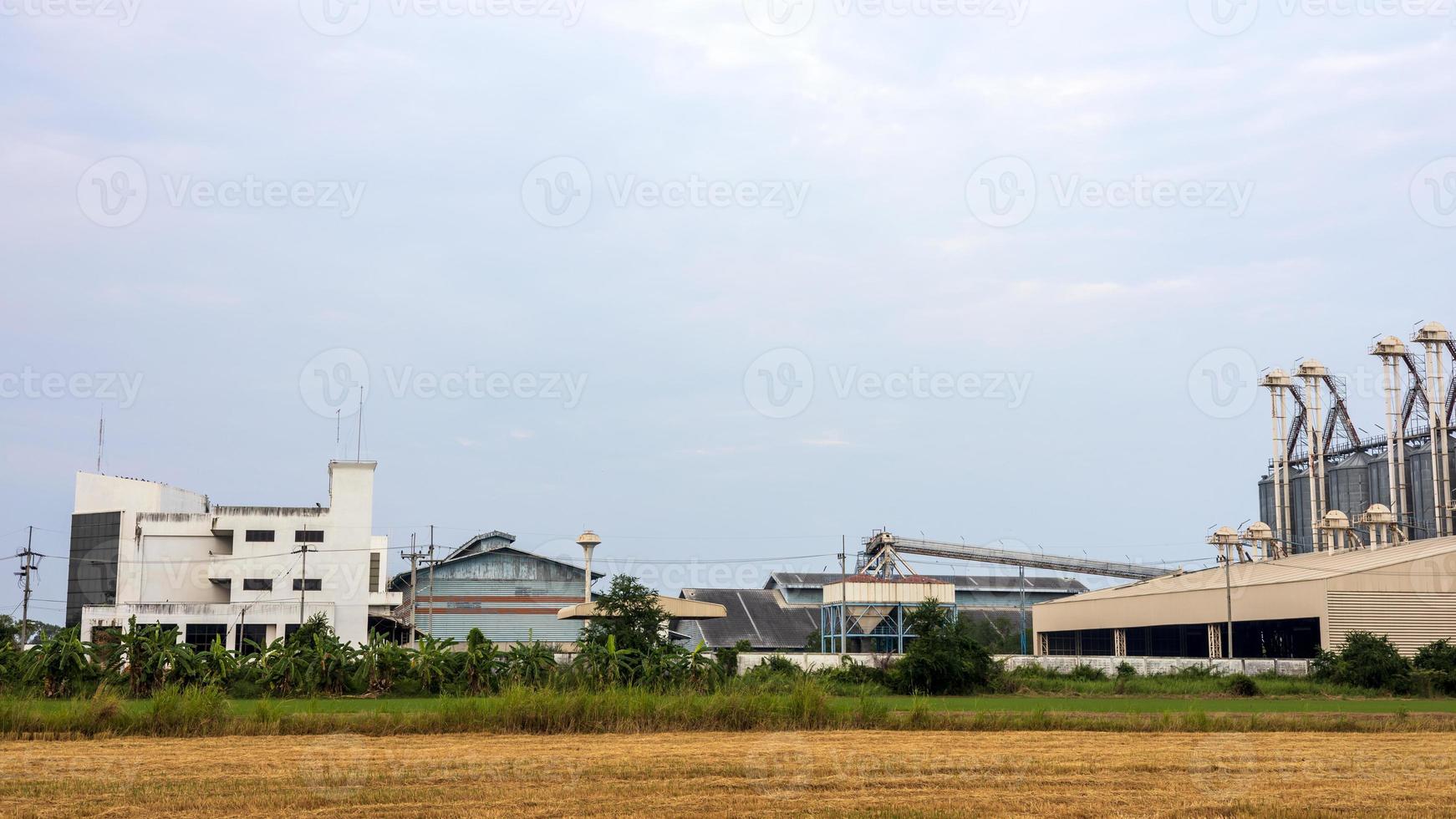 View of an old factory building used as a barn for steaming rice grains. photo