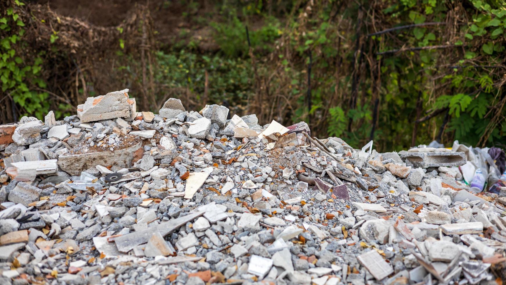 Close-up view of concrete rubble, bricks and small pieces of wood. photo