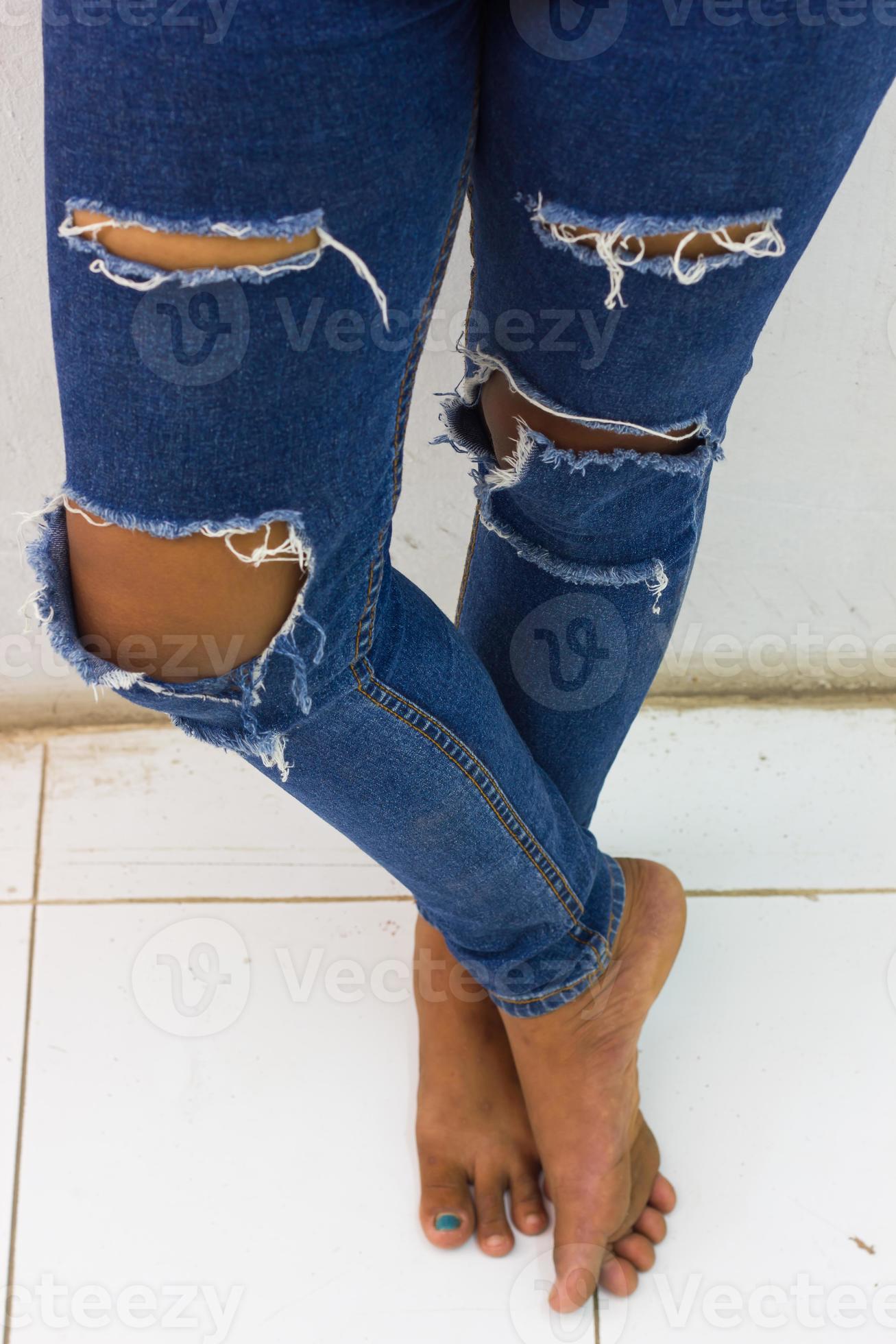 Torn jeans standing. 7552939 Stock Photo at Vecteezy