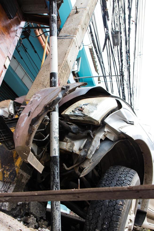 Below the car hit the pole. photo
