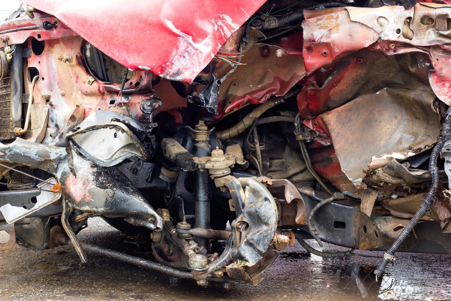 Wrecked red car accident. photo