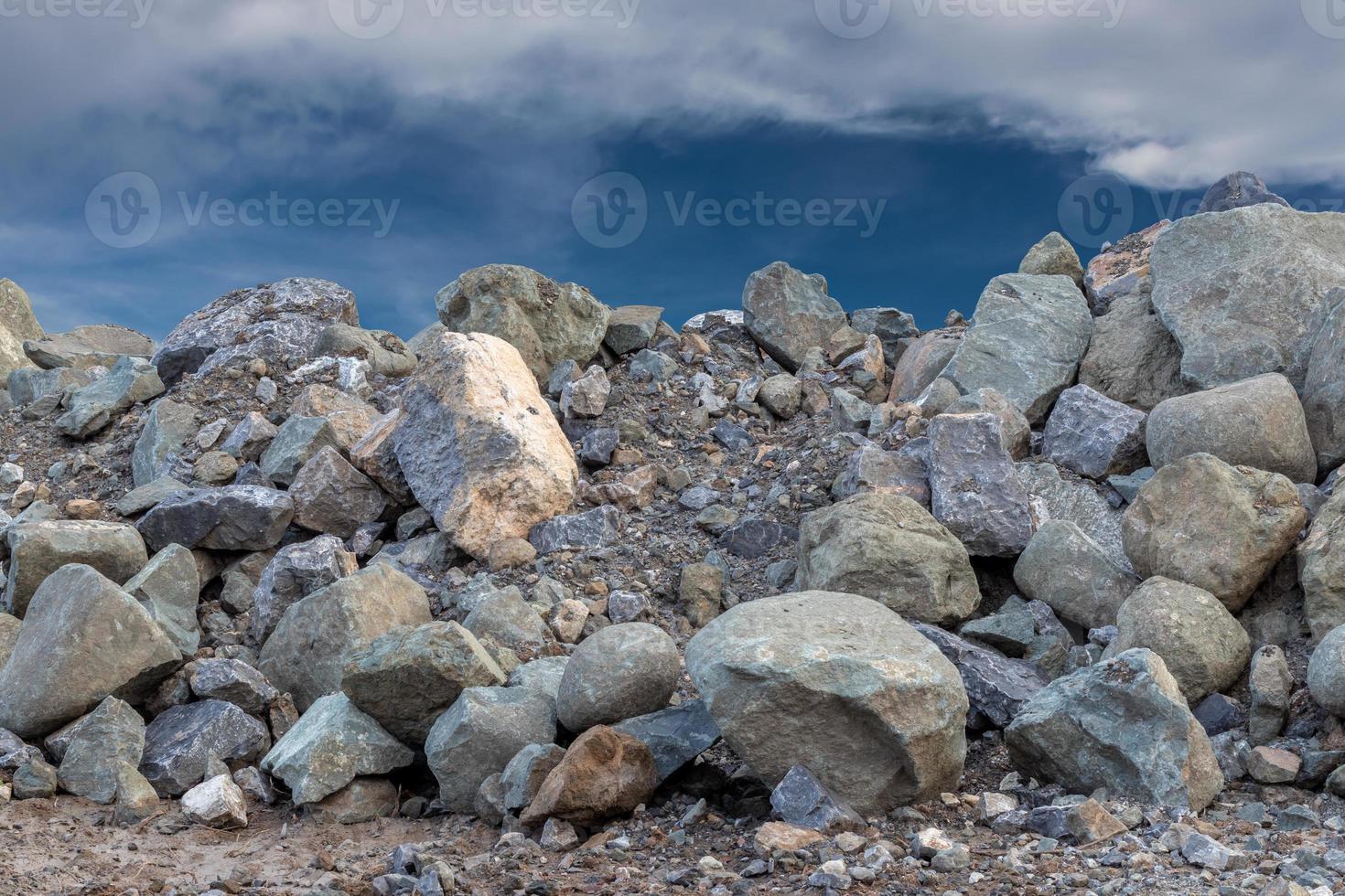 A large granite pile under the sky. photo