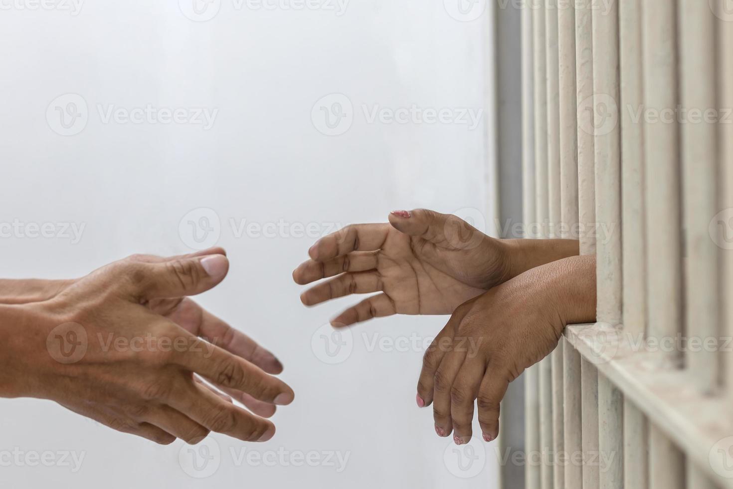 Hand handshake husband and wife who were imprisoned. photo