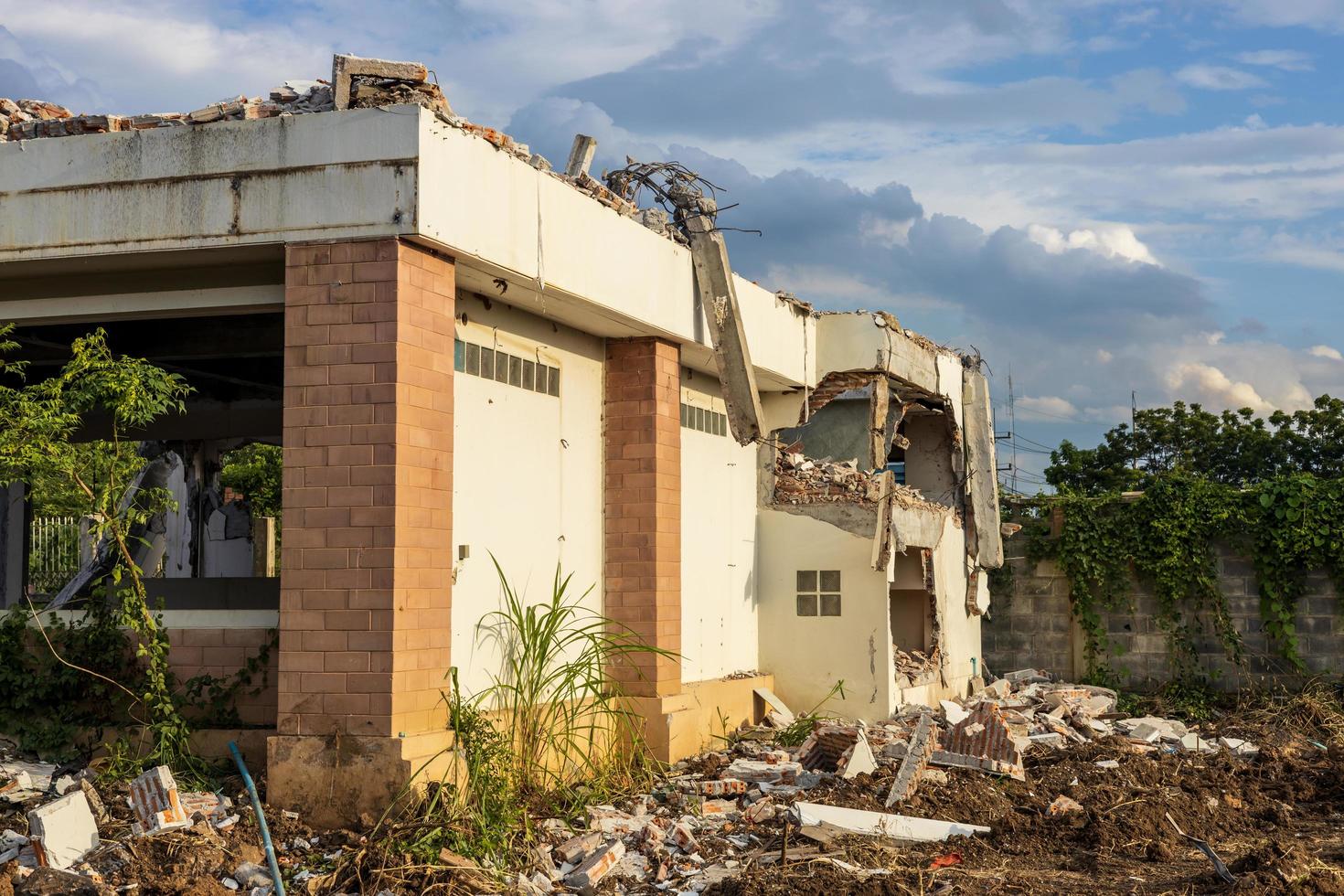 Ruins of an old abandoned building with cloudy clouds and blue sky. photo