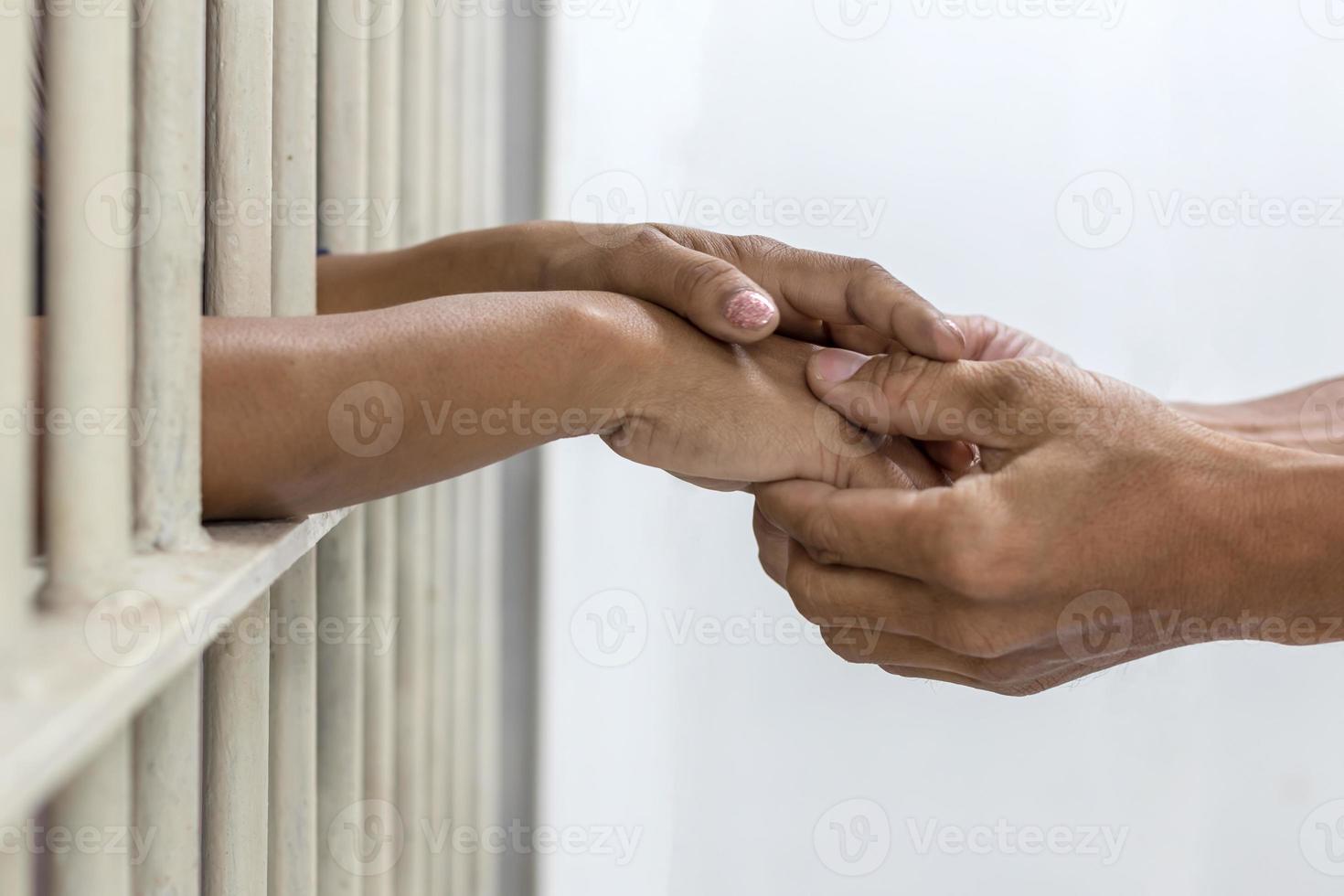 Hand handshake husband and wife who were imprisoned. photo