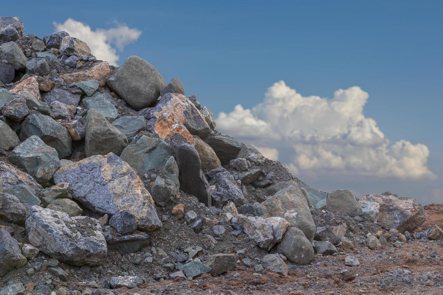 Many granite piles with sky clouds. photo