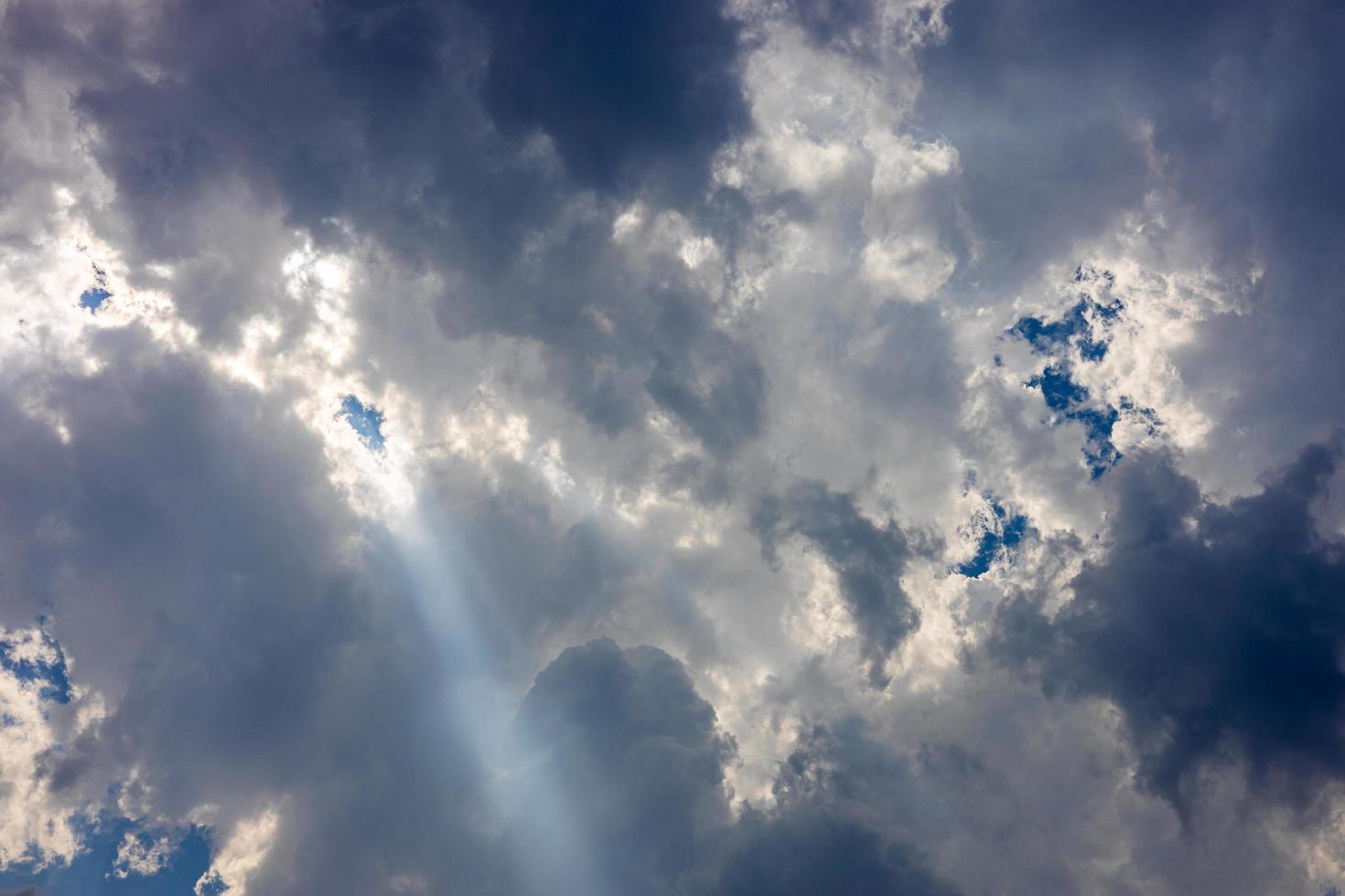 Background of a landscape of clouds with sunlight shining through. photo