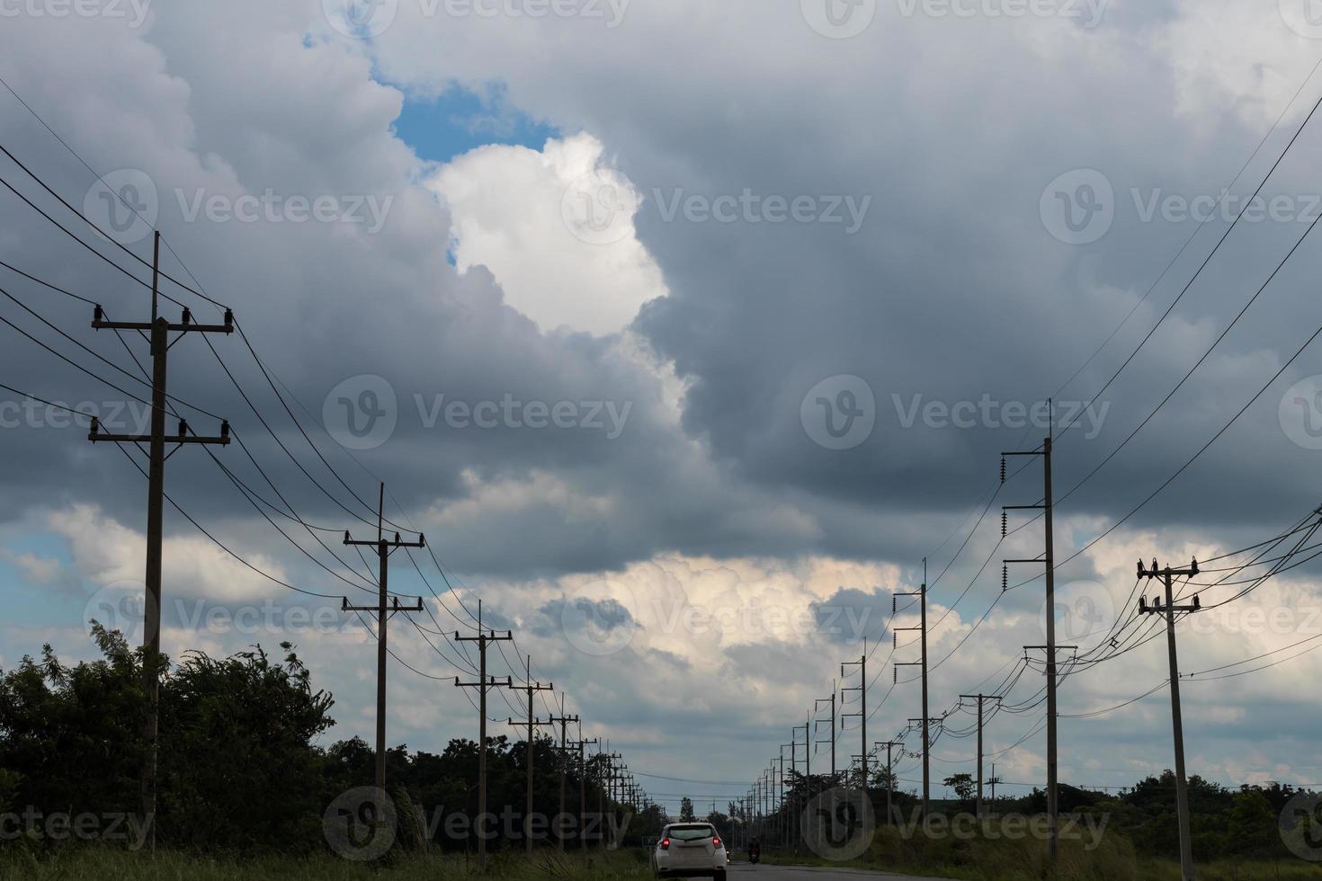 Clouds over rural electricity poles. photo