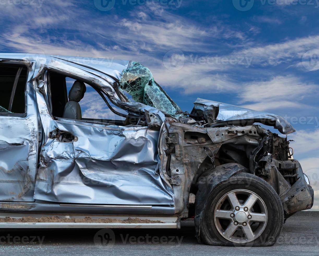 Bronze cars demolished with skies. photo