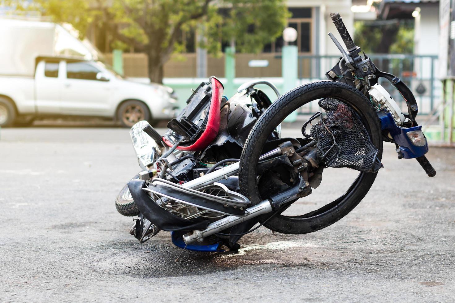 Motorcycle demolished on the road. photo