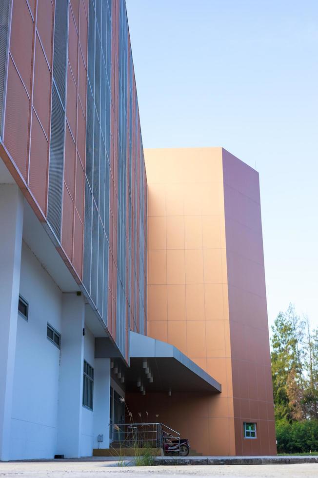 Low angle view, close-up view of a beautiful orange new building. photo