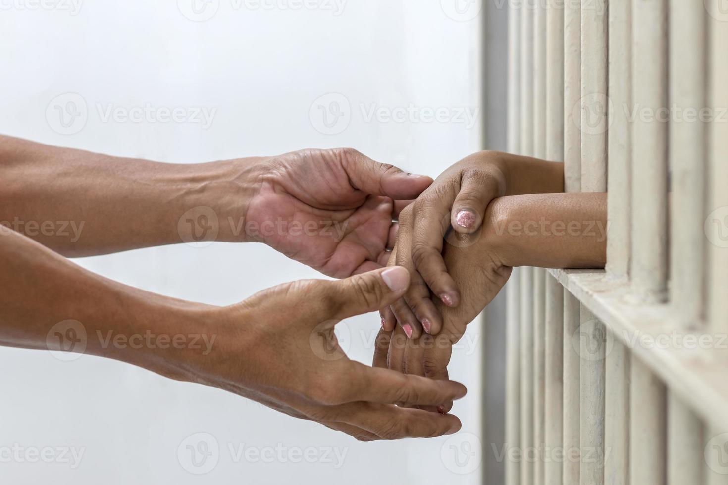 Hand handshake husband and wife who were imprisoned. photo