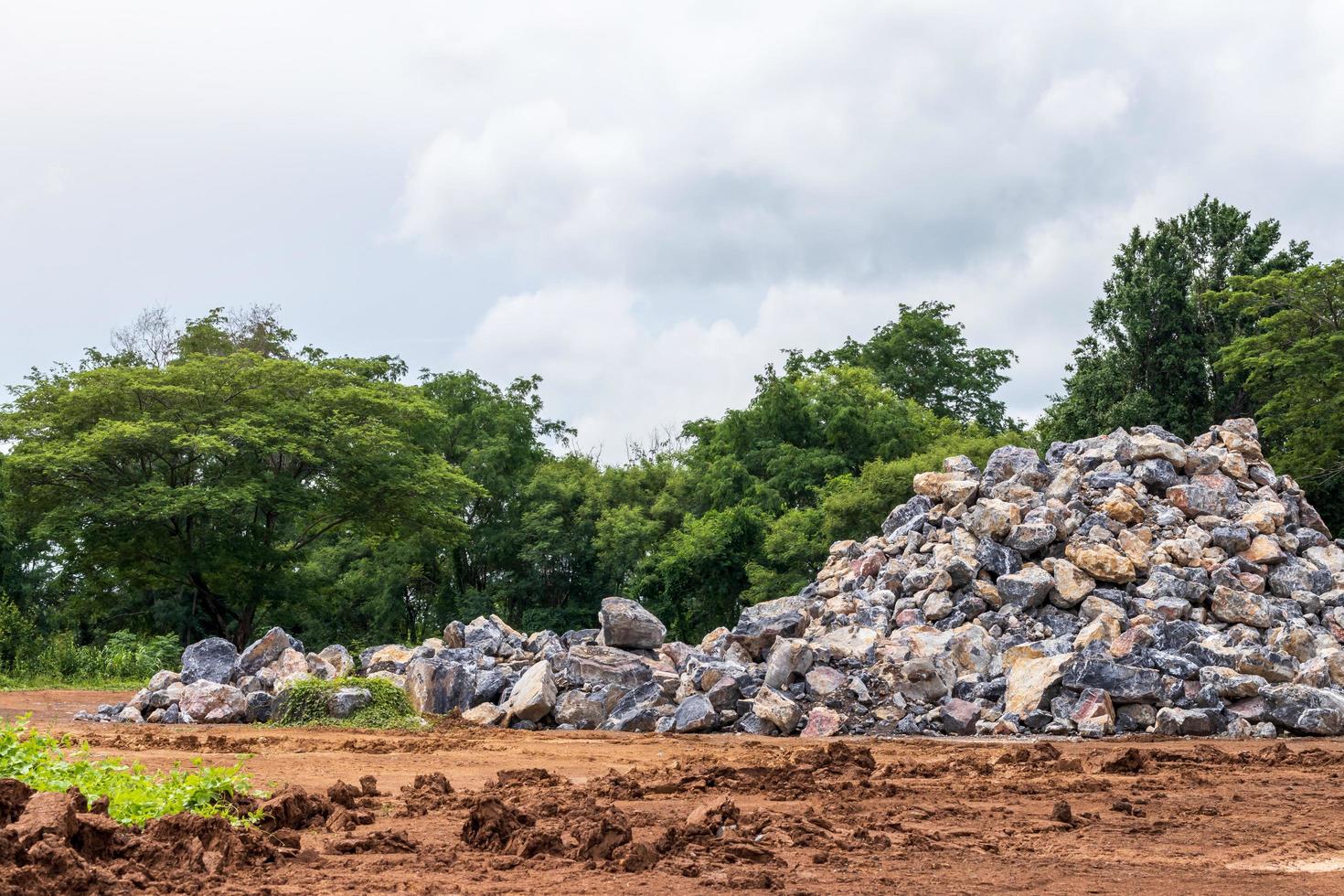 Numerous granite boulders lie on the ground in rural areas. photo