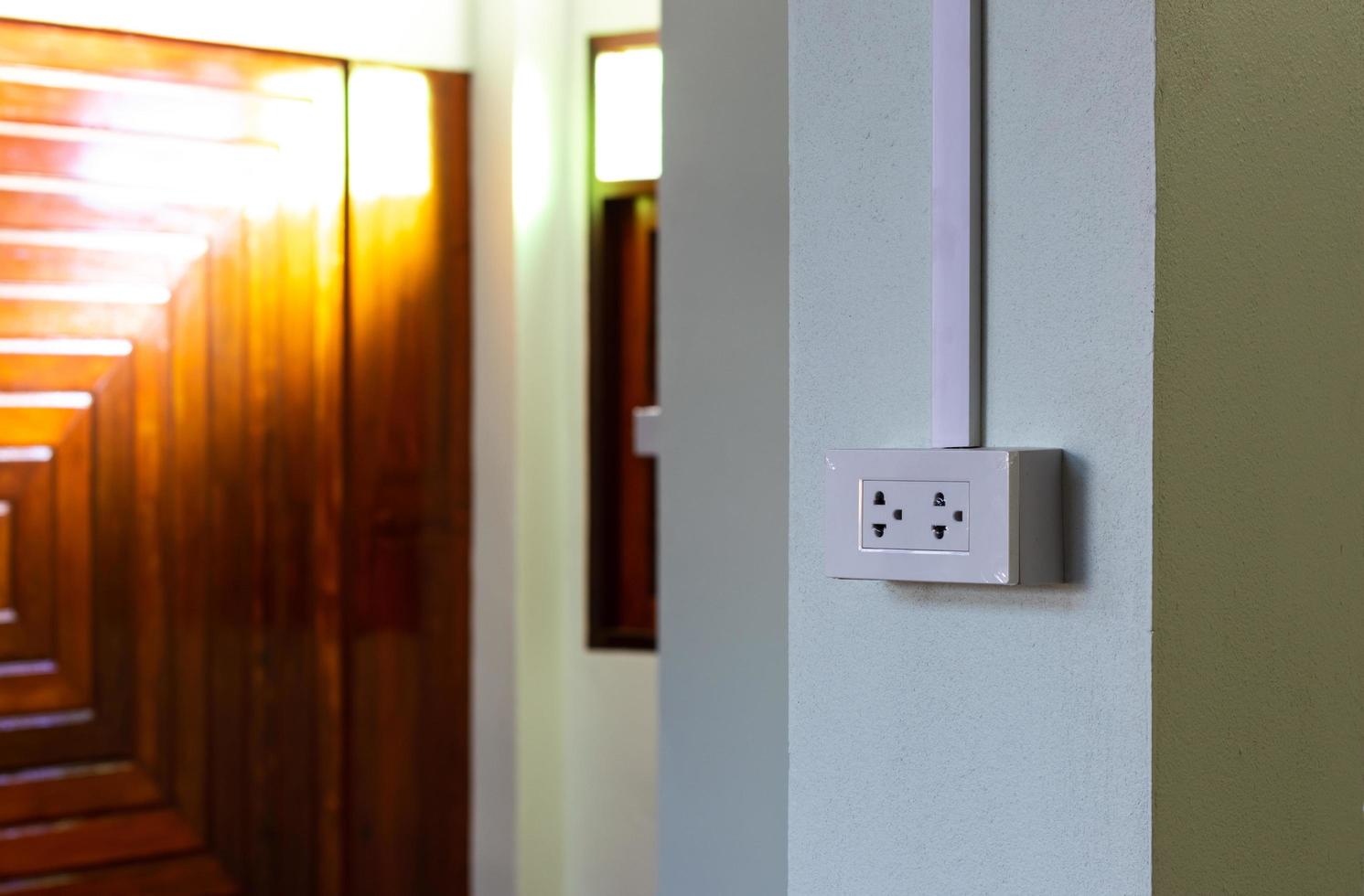 New power sockets on concrete and wood walls. photo