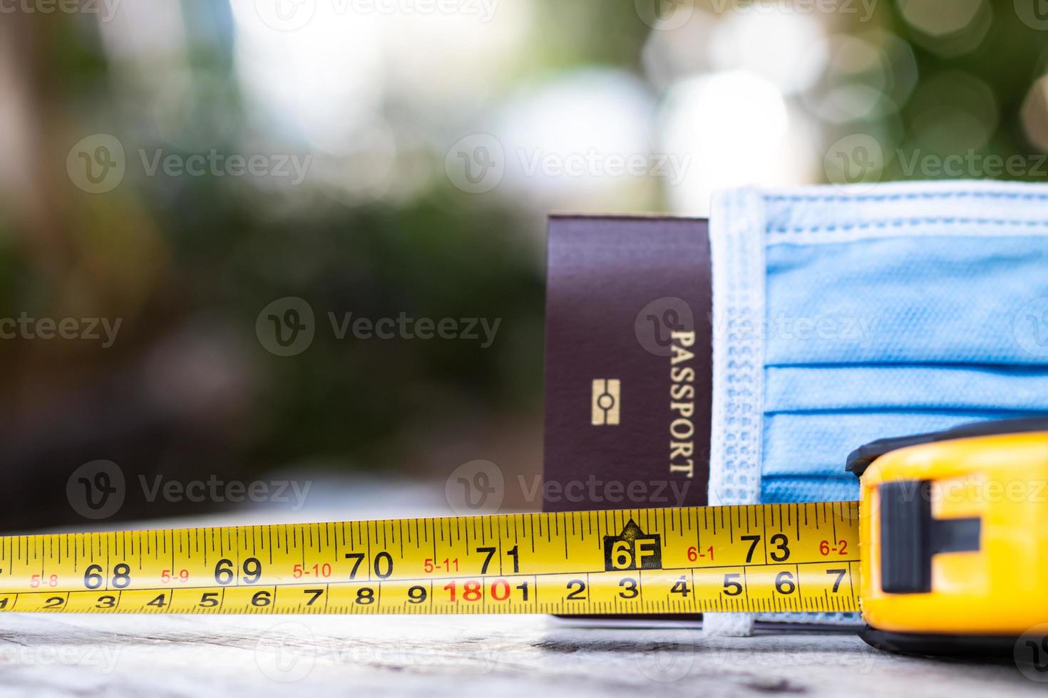The measuring unit of the tape measure near the passport. photo