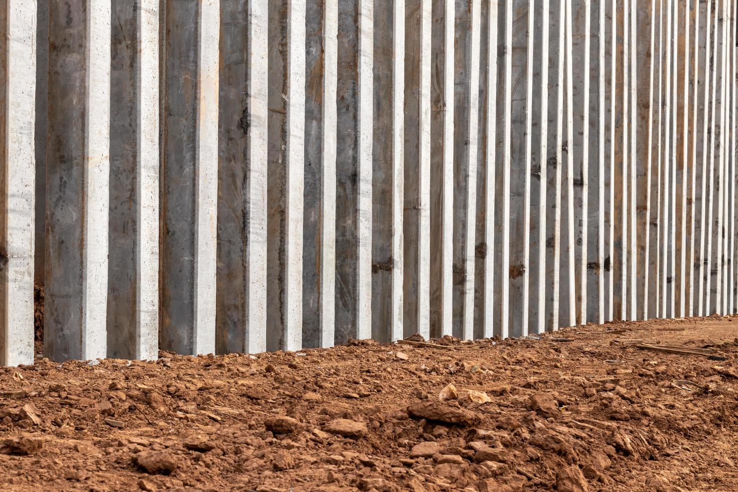 Many concrete columns prevent the erosion of soil on the river shore. photo