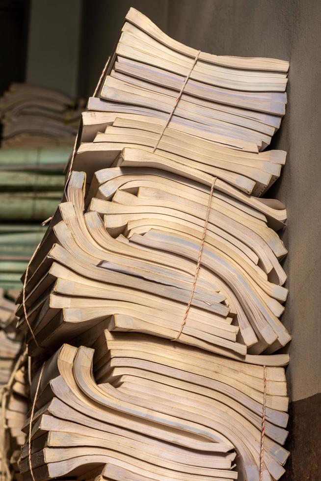 Many old books were stacked together. photo