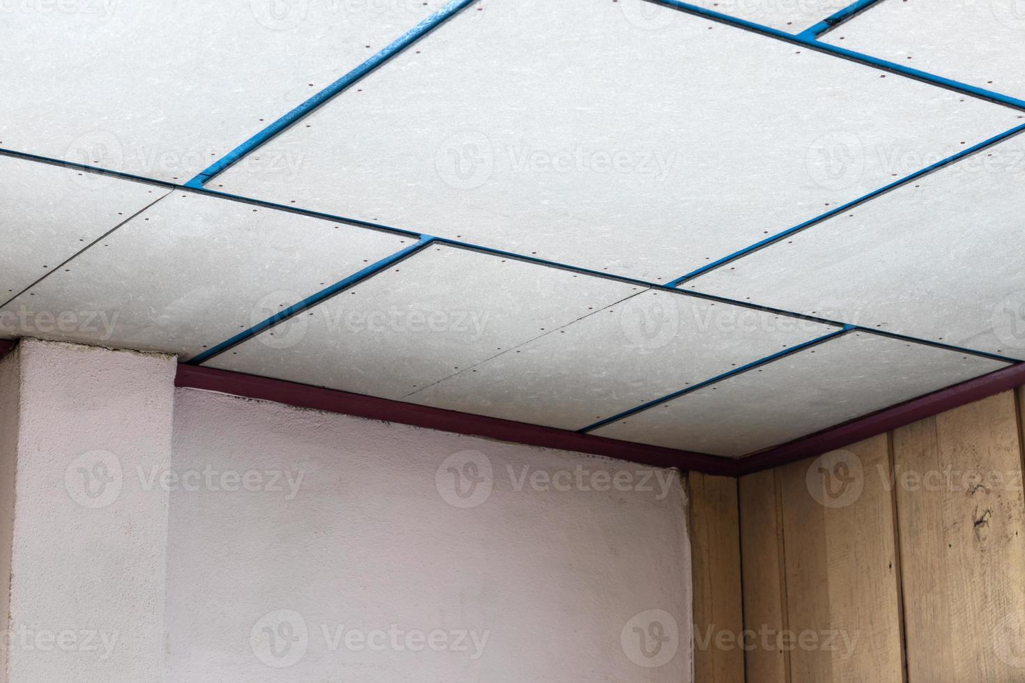 Ceiling panels in the old room prepared for renovation. photo