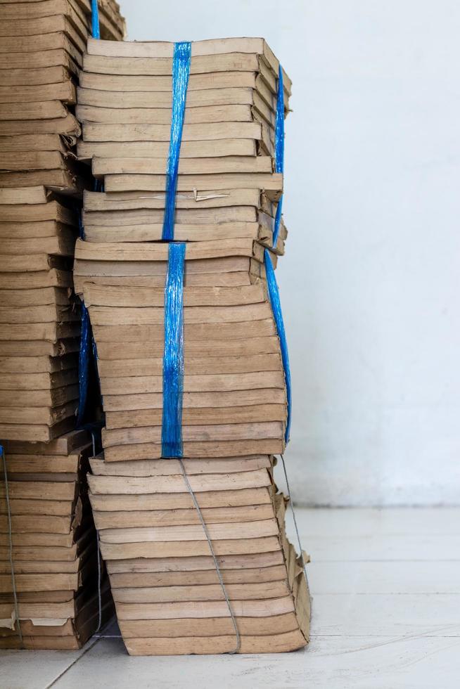 Many old books were stacked together. photo