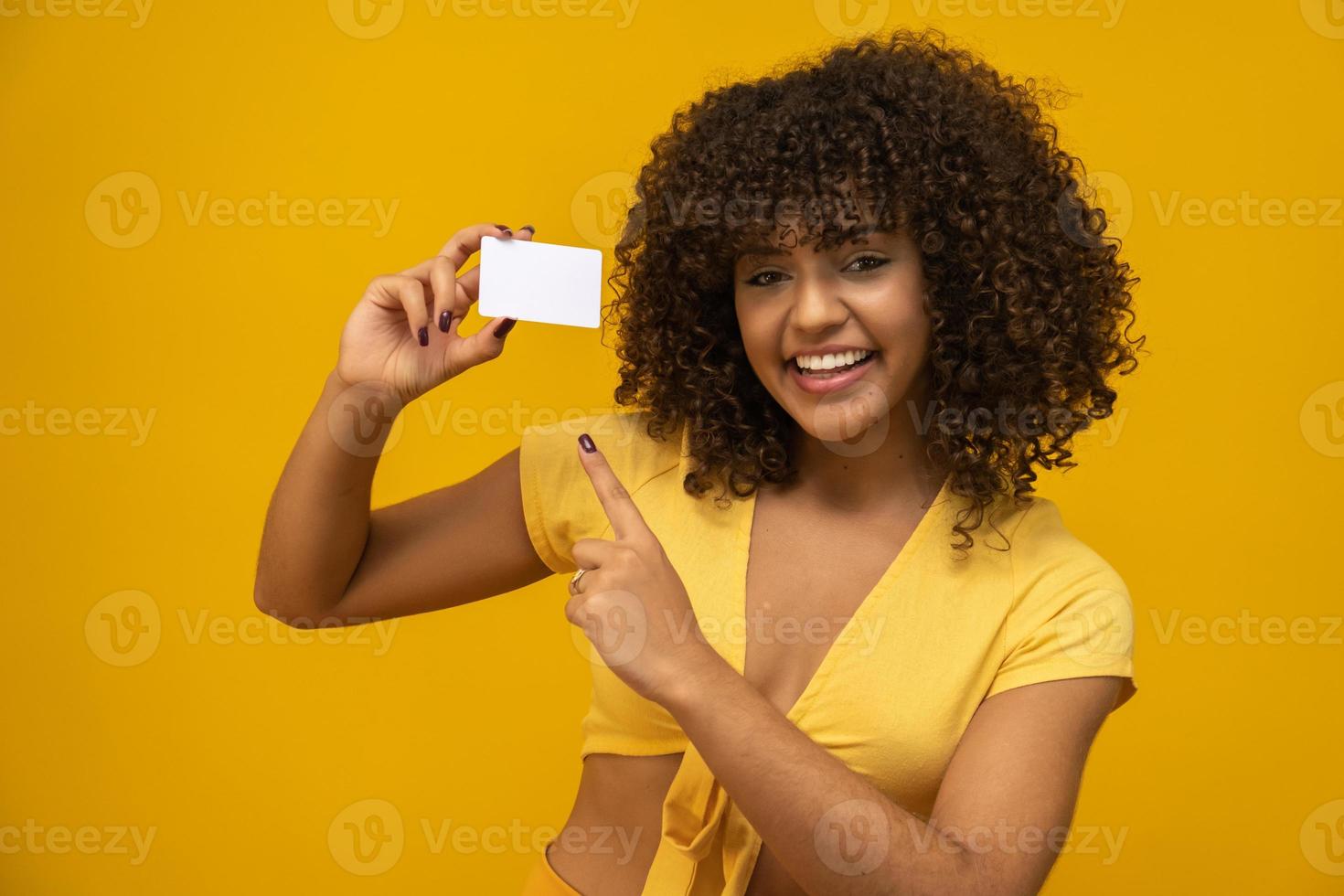 Young woman hand hold blank white card mockup with rounded corners. Plain call-card mock up template holding arm. Plastic credit namecard display front. Check offset card design. Business branding. photo