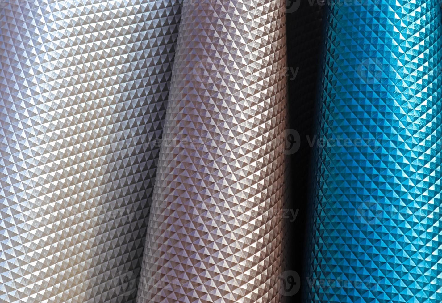 Samples of cloth and fabrics in different colors found at a fabrics market. photo