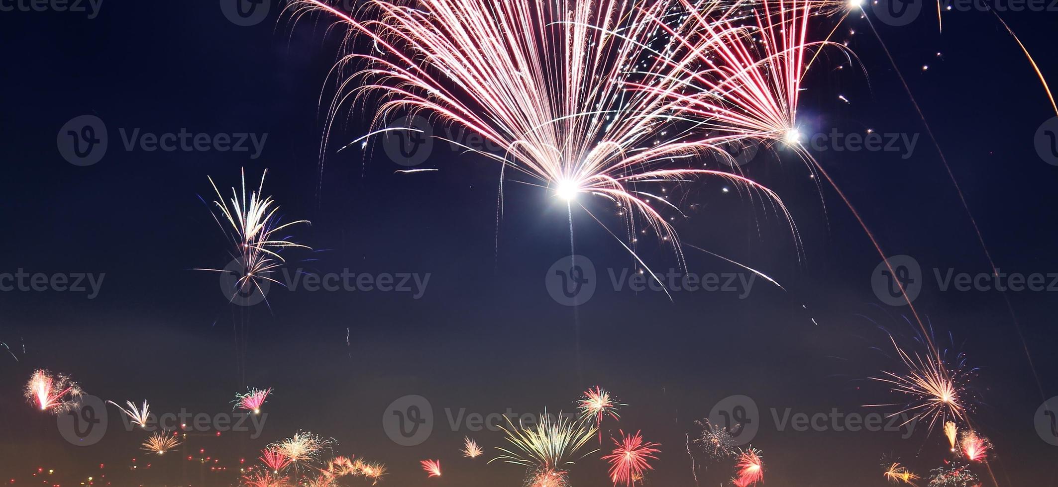 Long time exposure of fireworks over the roofs of vienna photo