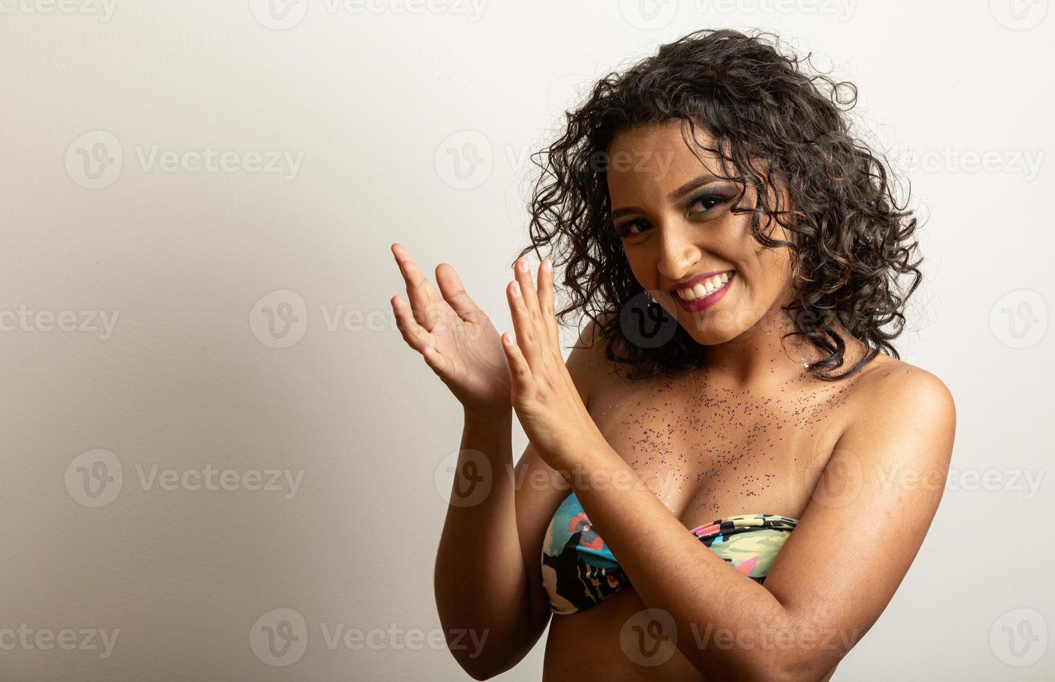 Brazilian Carnival. Young woman in costume enjoying the carnival party. photo